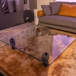 Couchtisch Tavola con Ruota Grande, Design Gea Aulenti 1980, geschliffenes Glas 15 mm, Gestell Rollen schwarz