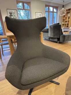 Sessel Caruzzo Plus Stoff Apollo Dunkelgrau Braun Drehgestell Schwarz Lackiert Inklusive Hocker