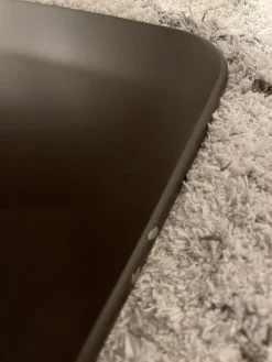 Sessel Jalis Leder 492 Dunkelbraun mit drehbarem Tellefuß und Hocker