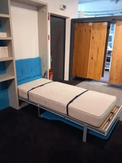 Systemwand Telemaco Strukturlack Canapa Hellblau Und Weiss Mit LED Beleuchtung Und Intrigierten Klappbett Ohne Dekoration