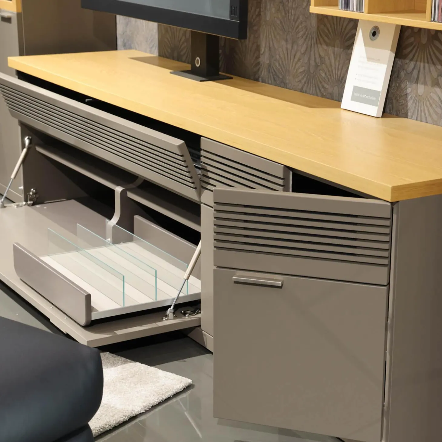 Wohnwand Flair Rahmenfarbe Eiche Sand Lack Terra Grau Griff T8 Edelstahlfarbig Mit LED Beleuchtung